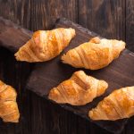 Delicious,Fresh,Mini,Croissants,On,Wooden,Cutting,Board,On,Old