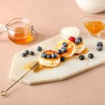 Board,With,Tasty,Cottage,Cheese,Pancakes,,Berries,And,Honey,On