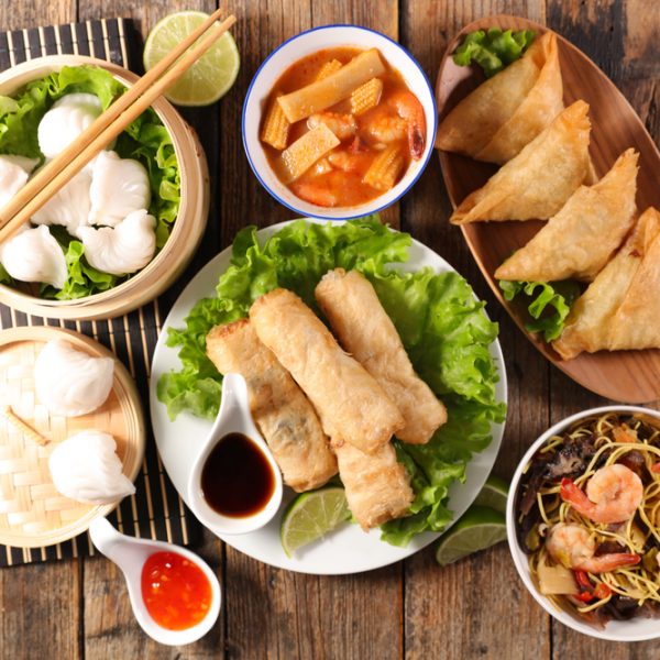asian food selection with spring roll,noodles soup, dumpling and sauce