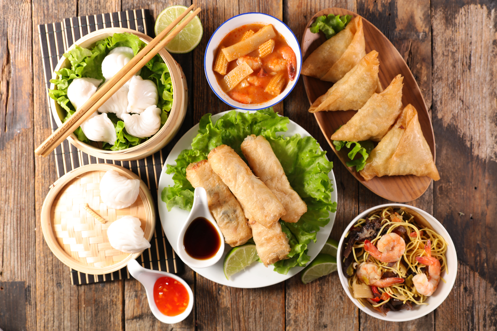 asian food selection with spring roll,noodles soup, dumpling and sauce
