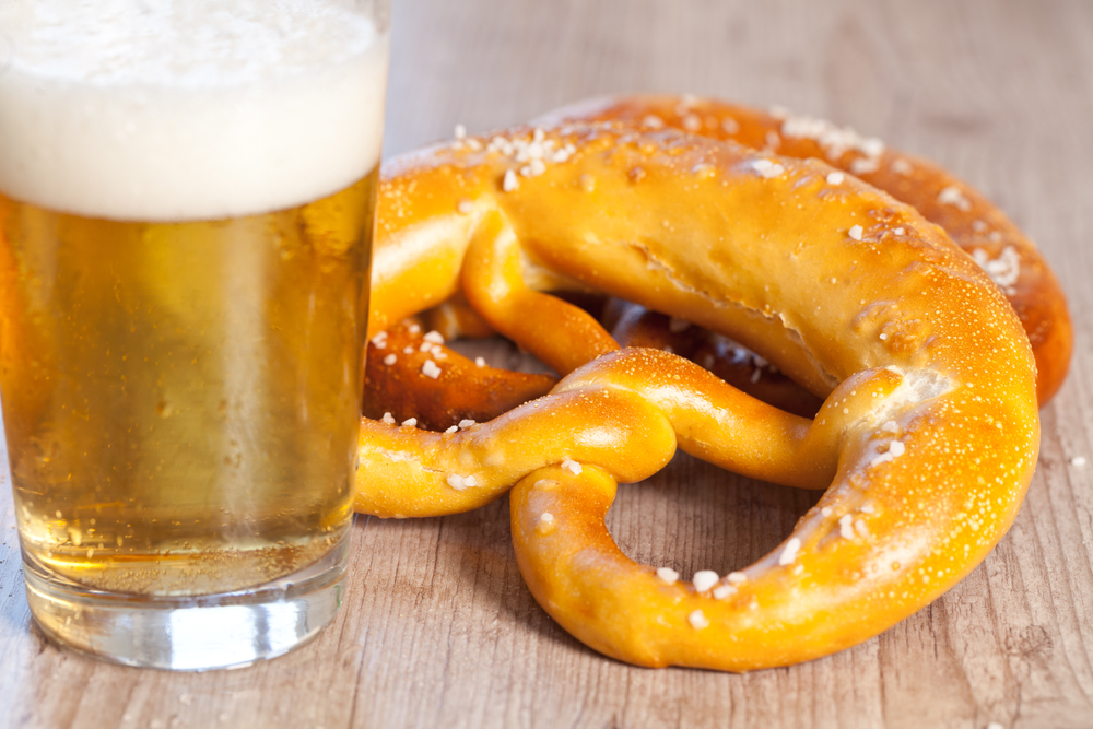 Typical crusty german pretzel bread with beer